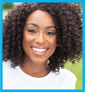 attractive young woman with black curly hair